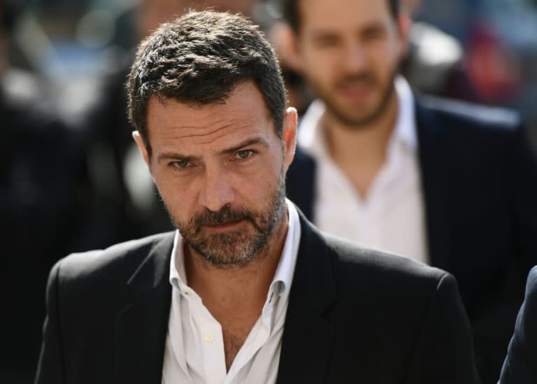 French "rogue trader" Jerome Kerviel leaves after his appeal trial, where he was ordered on to pay 1.0 million euros to his former employer Societe Generale on September 23, 2016