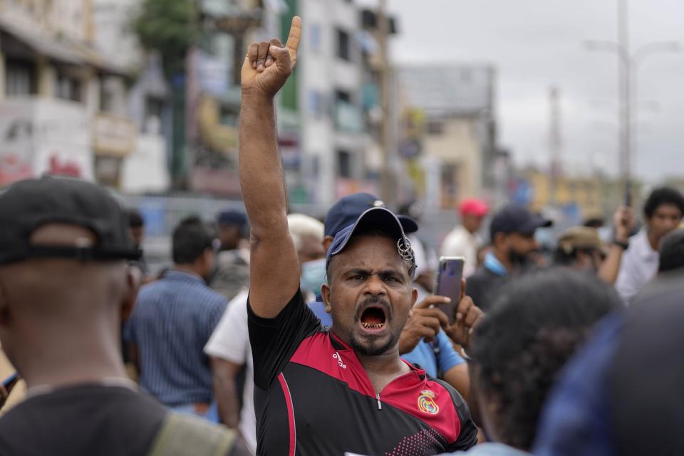 A man shouts anti-government slogans during a protest against military eviction of protesters from the president's office in Colombo, Sri Lanka, Friday, July 22, 2022. (AP Photo/Eranga Jayawardena)