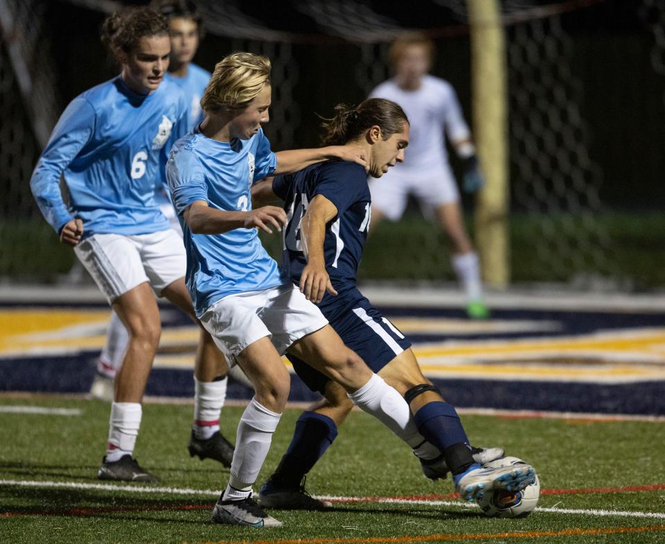 TRN Anthony Ruggiero and TRE Luke Bodziak battle for ball in second half action. Toms River East Boys Soccer edges out Toms River North 3-2 in overtime of first round SCT game in Toms River, NJ on October 11, 2022. 