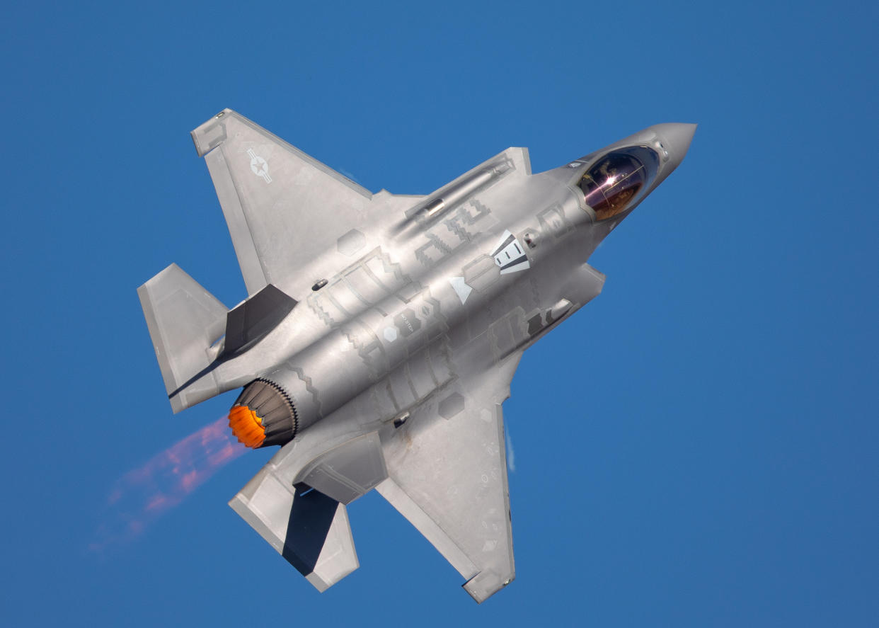 Very close top view of an F-35 Lightning II  with afterburner on