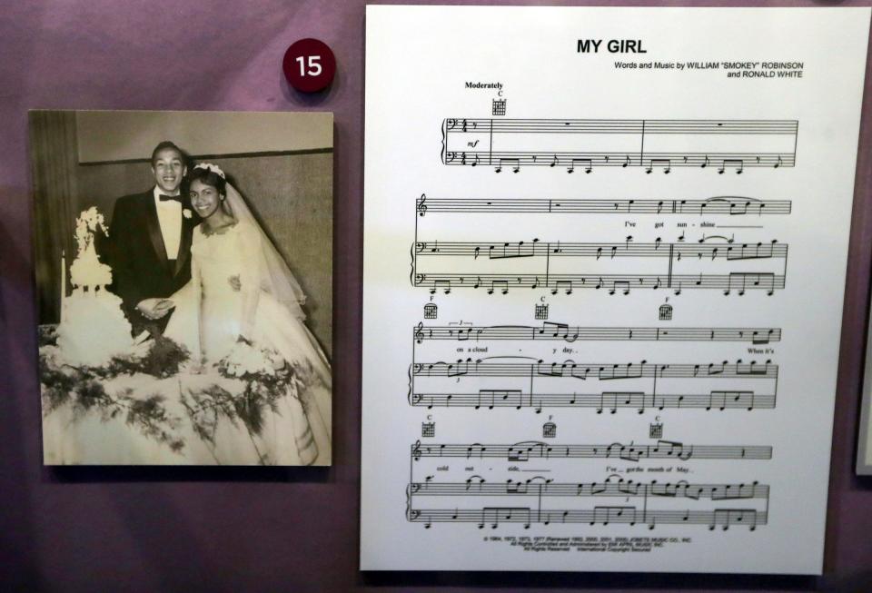 A wedding picture of Claudette and husband Smokey Robinson along with sheet music to "My Girl" on display in the exhibit.