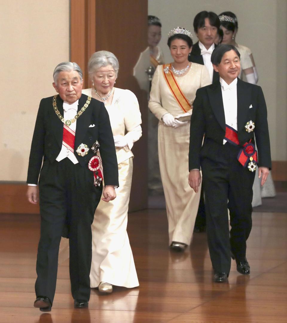 Japanese Emperor Akihito, left, and Empress Michiko, second from left, Crown Prince Naruhito, right, and Crown Princess Masako, second from right, arrive for an imperial ceremony in the celebration of New Year at the Imperial Palace in Tokyo, Tuesday. Jan. 1, 2019. (Kyodo News via AP)