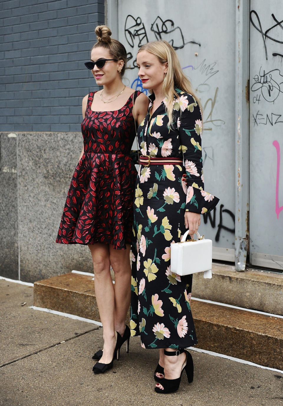 Two friends look fabulous in floral at New York Fashion Week.