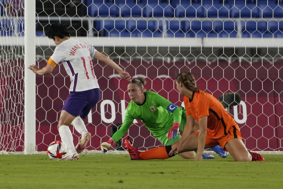 China's Wang Shanshan (11) attempts to kick a goal during a women's soccer match against Netherlands at the 2020 Summer Olympics, Tuesday, July 27, 2021, in Yokohama, Japan. (AP Photo/Kiichiro Sato)