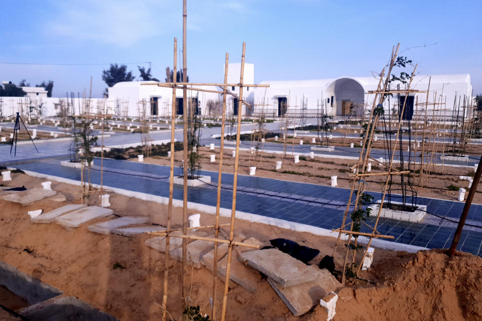 A view of the cemetery for migrants who have died trying to reach Europe in the village of Zarzis, Tunisia, Saturday June 12, 2021. A newly sanctified cemetery for Tunisia's migrant dead is filling quickly. Rachid Koraïchi bought the plot of land in the port city of Zarzis a few years ago and started designing what he hoped would be the final resting place for people who died on the move. (AP Photo/Mehdi El Arem)