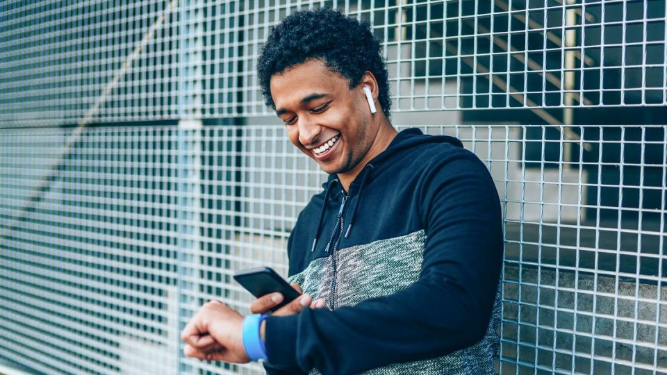 sportsman checking his smart watch