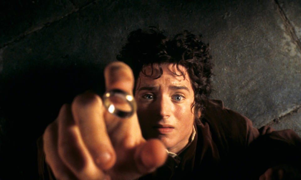 Frodo on the inn floor as the ring falls onto his finger