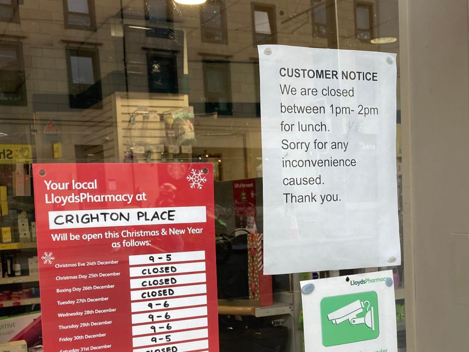 A pharmacy closed for lunch in Scotland.