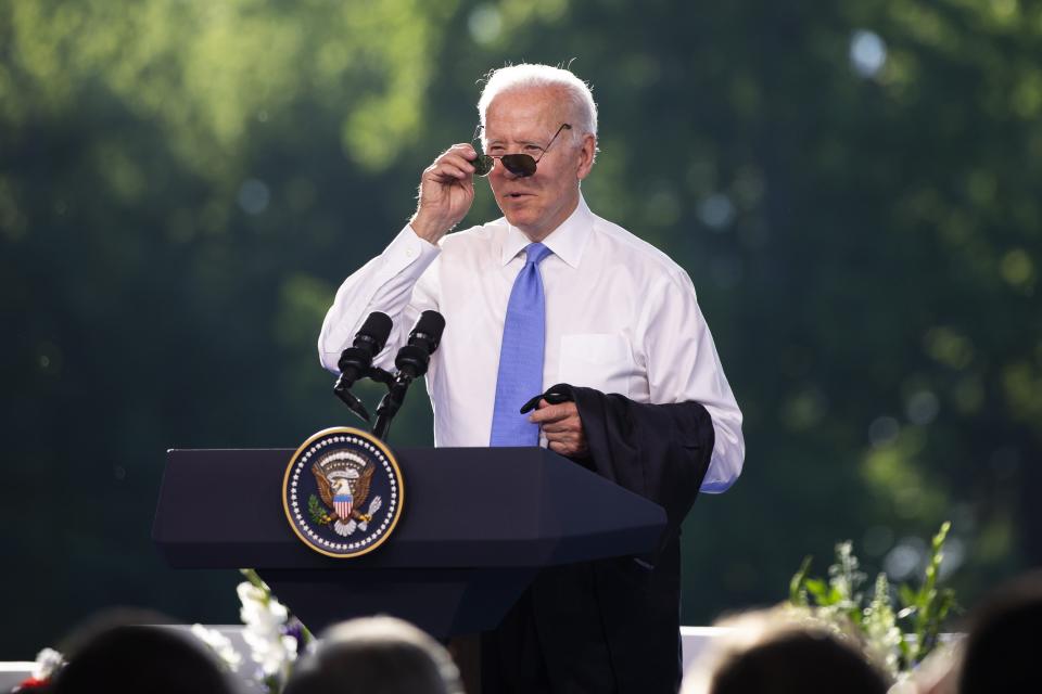 President Biden puts on his sunglasses at the end of the press conference (EPA)