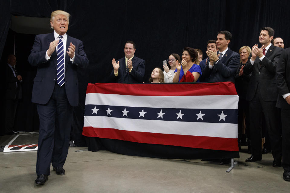 President-elect Donald Trump at a Wisconsin rally in December 2016. Among the welcomers are House Speaker Paul Ryan, R-Wis., right, and Gov. Scott Walker, R-Wis., second from right. (Photo: Evan Vucci/AP)