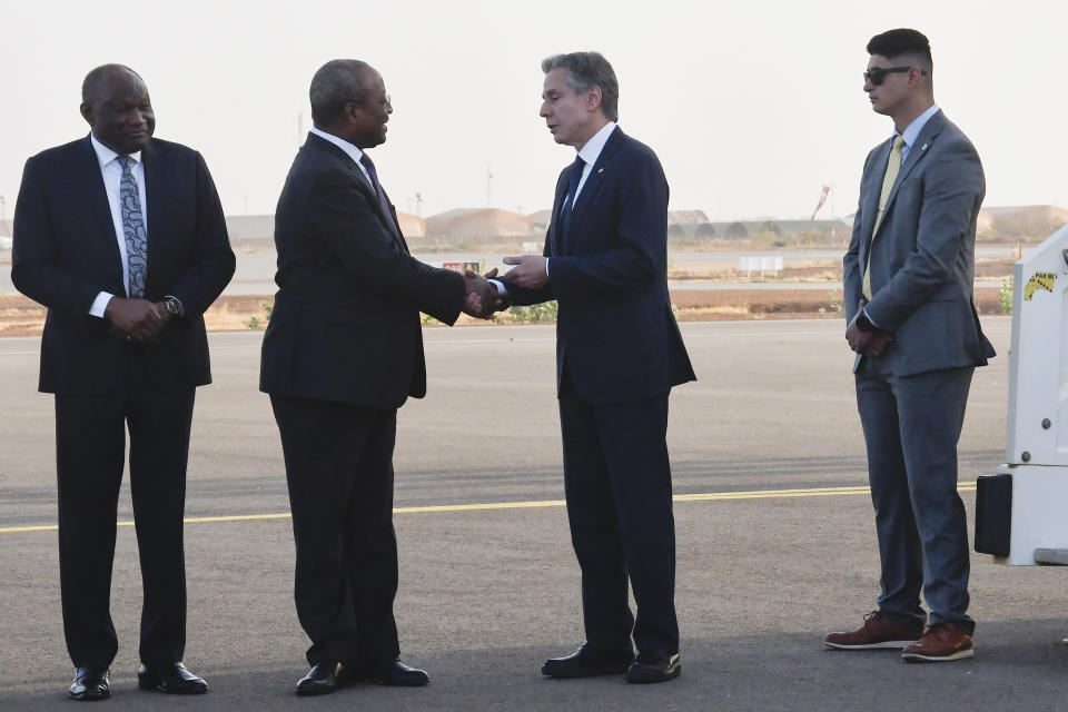 US Secretary of State Antony Blinken centre right, shakes hands with Nigerien Foreign Minister Hassoumi Massoudou, as he departs the country, at the Diori Hamani International Airport in Niamey, Niger, Friday, March 17, 2023. (Boureima Hama/Pool Photo via AP)