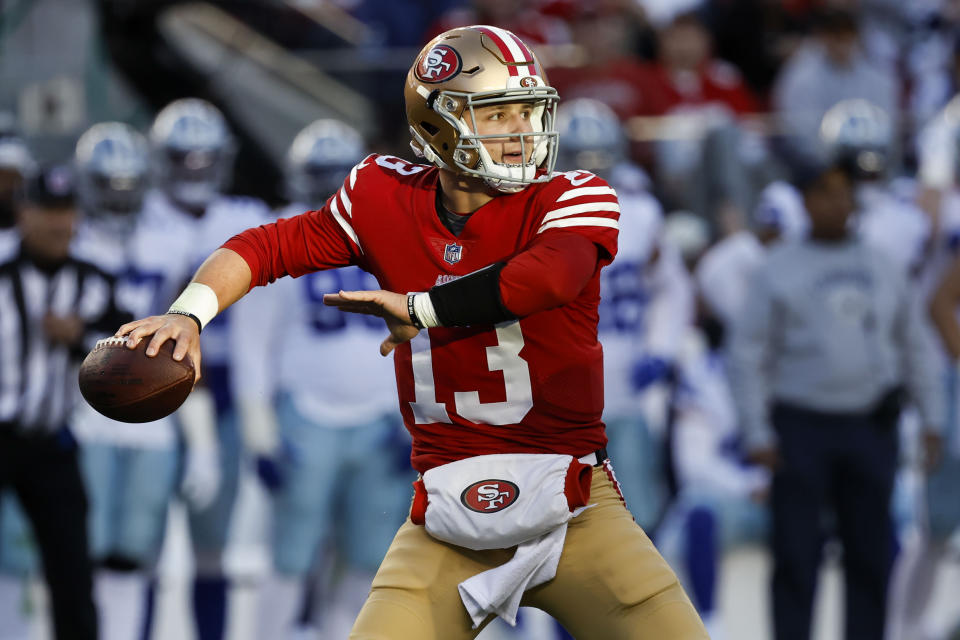 San Francisco 49ers quarterback Brock Purdy (13) passes against the Dallas Cowboys during the first half of an NFL divisional round playoff football game in Santa Clara, Calif., Sunday, Jan. 22, 2023. (AP Photo/Josie Lepe)