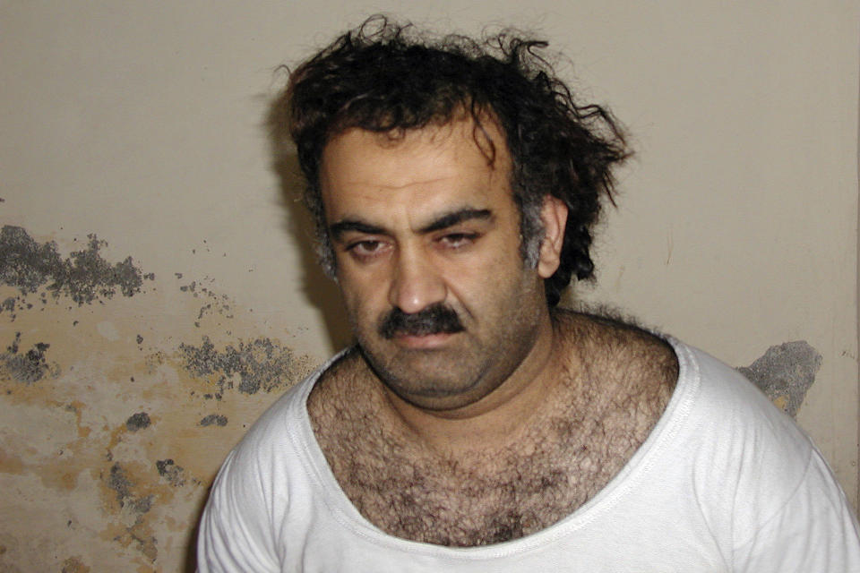 FILE — Khalid Sheikh Mohammed, the alleged Sept. 11 mastermind, is seen shortly after his capture during a raid in Pakistan, March 1, 2003. As Sunday's 21st anniversary of the terror attacks approaches, Mohammed and four other men accused of 9/11-related crimes still sit in a U.S. detention center in Guantanamo Bay, their planned trials before a military tribunal endlessly postponed. (AP Photo/File)