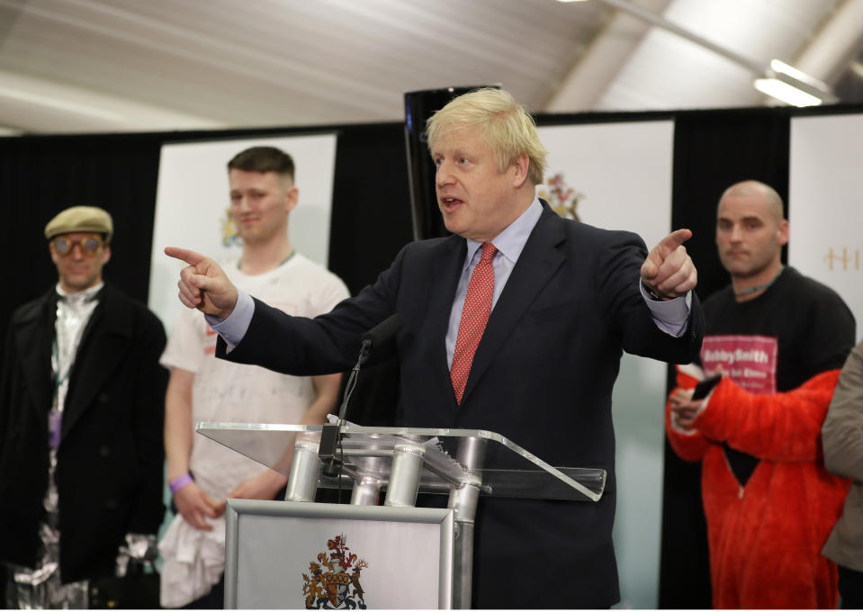 Britain's Prime Minister and Conservative Party leader Boris Johnson gestures as he speaks after the Uxbridge and South Ruislip constituency count declaration at Brunel University in Uxbridge, London, Friday, Dec. 13, 2019. (AP Photo/Kirsty Wigglesworth)