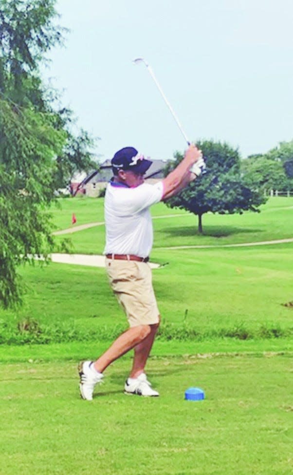 Terry Hughes rips the ball during play at Adams Golf Course.