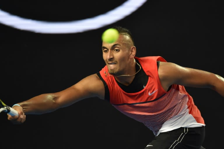 Australia's Nick Kyrgios hits a return against Uruguay's Pablo Cuevas on day three of the Australian Open in Melbourne on January 20, 2016