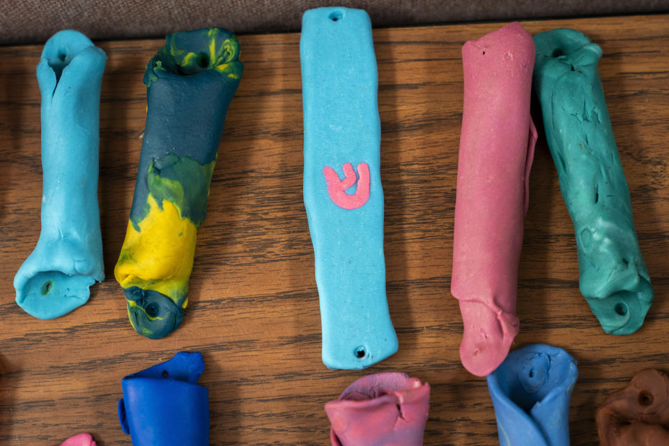Clay mezuzahs are among the art project made by campers during Camp Be'chol Lashon, a sleepaway camp for Jewish children of color, Friday, July 28, 2023, in Petaluma, Calif., at Walker Creek Ranch. (AP Photo/Jacquelyn Martin)