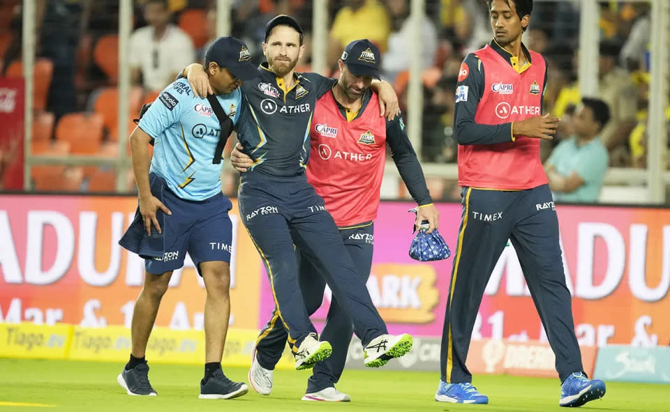 Kane Williamson is carried off the field during the opening match of the IPL season. (AP Photo/Ajit Solanki)