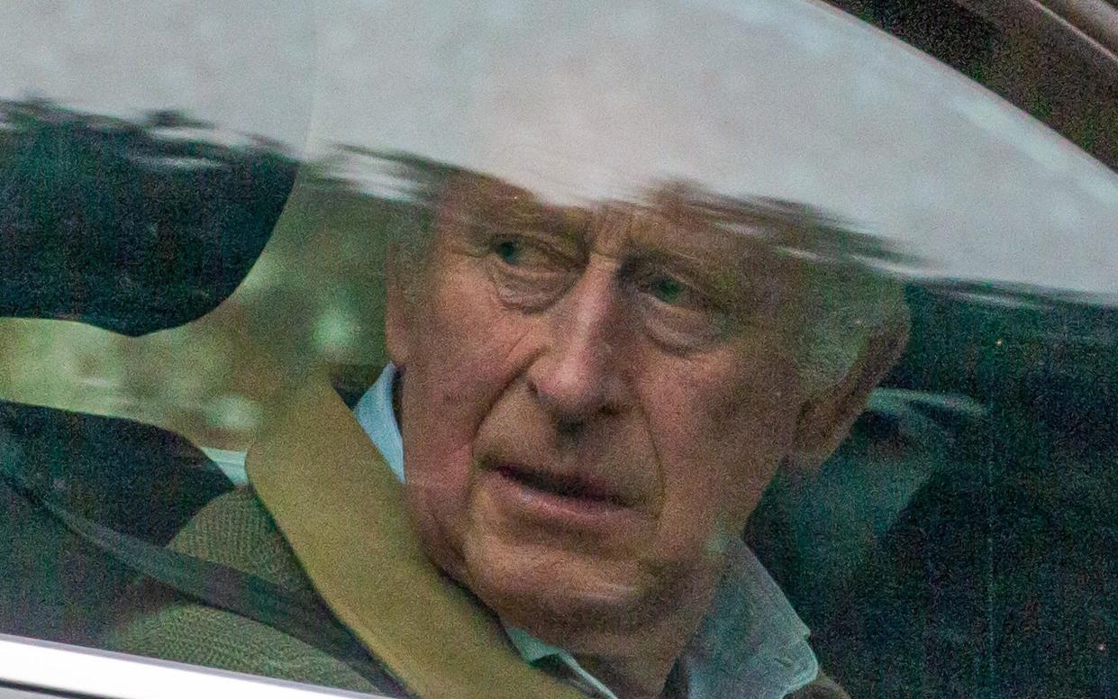 King Charles looks pensive as he drives out of the gates at Sandringham House in Norfolk this afternoon - Terry Harris/Bav Media