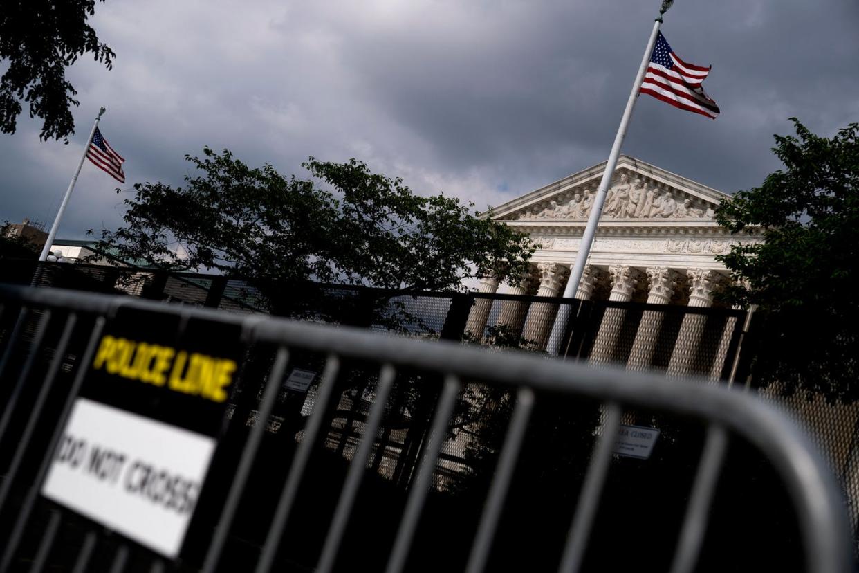 <span class="caption">Temporary security fencing surrounds the U.S. Supreme Court building, ahead of its decision on abortion.</span> <span class="attribution"><a class="link " href="https://media.gettyimages.com/photos/temporary-security-fencing-surrounds-the-us-supreme-court-in-dc-on-picture-id1241314994?s=2048x2048" rel="nofollow noopener" target="_blank" data-ylk="slk:Stefani Reynolds/AFP via Getty Images;elm:context_link;itc:0;sec:content-canvas">Stefani Reynolds/AFP via Getty Images</a></span>