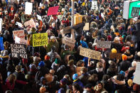 <p>Protestors gather at New York City's JFK International Airport on Jan. 28, 2017, in support of newly banned refugees and visitors wishing to enter the country. </p> <p>On Jan. 27, 2017, <a href="https://people.com/tag/donald-trump" rel="nofollow noopener" target="_blank" data-ylk="slk:President Donald Trump;elm:context_link;itc:0;sec:content-canvas" class="link ">President Donald Trump</a> signed an executive order that t<a href="https://people.com/politics/donald-trumps-new-travel-ban-6-muslim-majority-nations/" rel="nofollow noopener" target="_blank" data-ylk="slk:emporarily banned any refugees from entering the U.S.;elm:context_link;itc:0;sec:content-canvas" class="link ">emporarily banned any refugees from entering the U.S.</a>, indefinitely banned refugees who hail from Syria and temporarily banned citizens from several Muslim countries from entering the U.S. The order also required a “religious test” of sorts for refugees attempting to enter the U.S., giving preferential treatment to Christian and other religious minorities who live in Muslim countries over Muslims. The order, called the “Muslim ban” by Trump’s critics, outraged many and caused bottlenecks at major U.S. airports as stranded travelers filed for emergency appeals. The ACLU and others have fought the order in court since it was first introduced, though in 2018, the Supreme Court upheld a third version of the ban signed by Trump.</p>