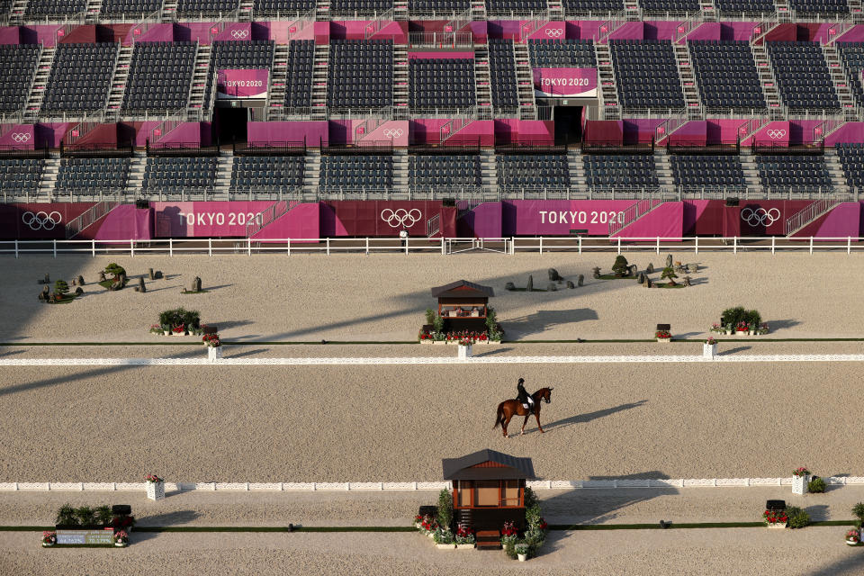 <p>TOKYO, JAPAN - JULY 25: Caroline Chew of Team Singapore riding Tribiani competes in the Dressage Individual Grand Prix Qualifier on day two of the Tokyo 2020 Olympic Games at Equestrian Park on July 25, 2021 in Tokyo, Japan. (Photo by Julian Finney/Getty Images)</p> 