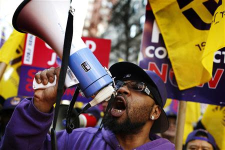 Members of the Service Employees International Union (SEIU) chant slogans during a protest in support of a new contract for apartment building workers in New York City, April 2, 2014. REUTERS/Mike Segar