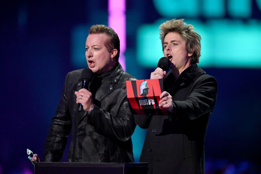 Tré Cool and Billie Joe Armstrong of Green Day came on stage to present an award.<span class="copyright">Gareth Cattermole—Getty Images</span>