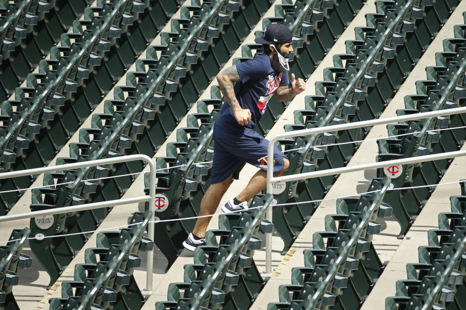 Minnesota Twins' Sergio Romo runs up steps in the ballpark at a baseball camp Friday, July 3, 2020, in Minneapolis. (AP Photo/Bruce Kluckhohn)