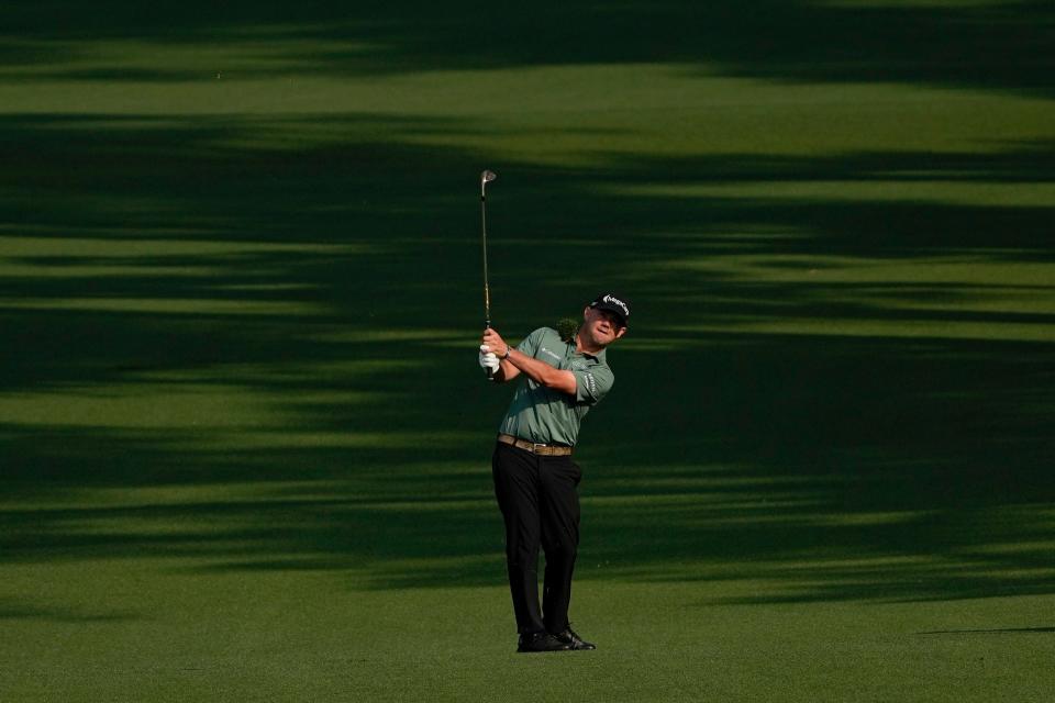 Brian Harman of St. Simons Island, Ga., hits his second shot from the second fairway of the Augusta National Golf Club.