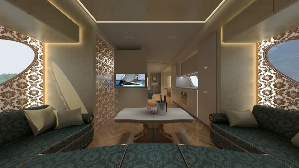 The living room area has a wrap-around sofa, 42-inch LED screen TV and adjacent bar cabinet and wine fridge. - Marchi Mobile Vienna