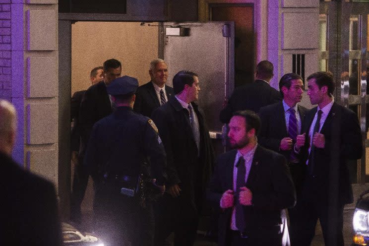 Vice President-elect Mike Pence, top center, leaves the Richard Rodgers Theatre after a performance of 