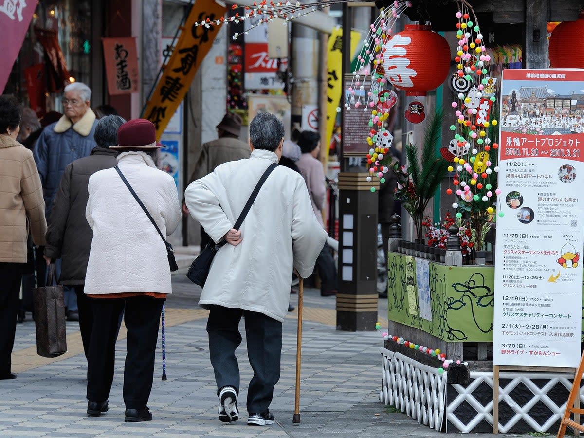 File. Elderly people walk in the street at Kouganji Temple in Tokyo, Japan (AFP/Getty)
