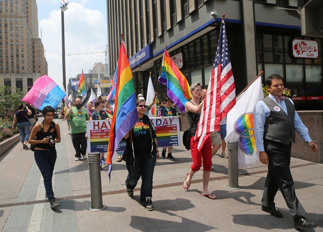 Supporters of gay marriage walk on Fountain Square on Wednesday, Aug. 6, 2014.