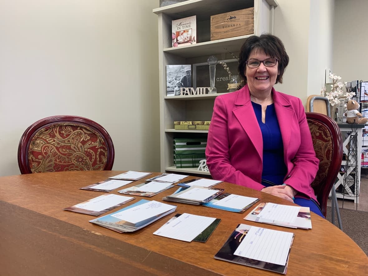 Karen Murdock runs Treasured Photo Collections, a photo organizing business in St. Albert. (Madeleine Cummings/CBC - image credit)