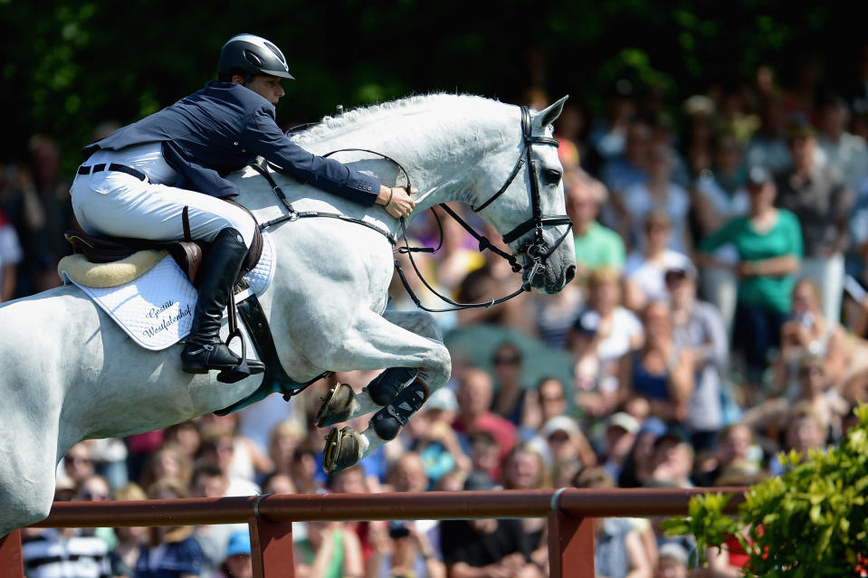 Torben Koehlbrandt of Germany and C-Trenton Z compete in the 83rd German Jumping Derby. (Photo by Dennis Grombkowski/Bongarts/Getty Images)