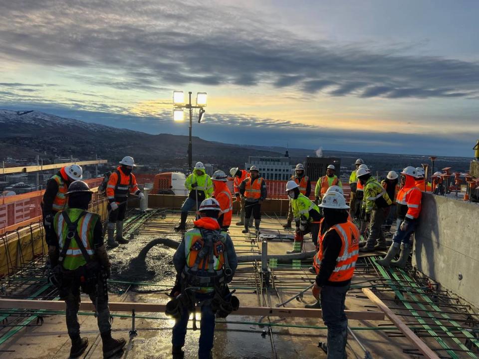 Workers pour cement during construction of The Arthur. The Zions Bank building can be seen in background, at center, and the U.S. Bank Building to its right. Courtesy of Oppenheimer Development Corp.