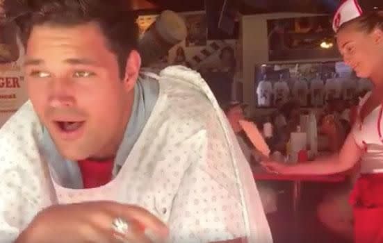 Apollo can be seen wearing a patient's gown during a visit to the controversial Heart Attrack Grill restaurant, and there's no silencing the magician as the waitresses get to work. Source: Facebook