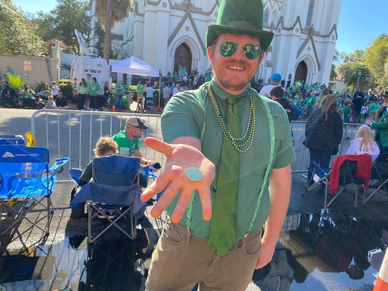 Ohio resident Zachary Allen performs magic tricks at his fifth Savannah St. Patrick's Day Parade.