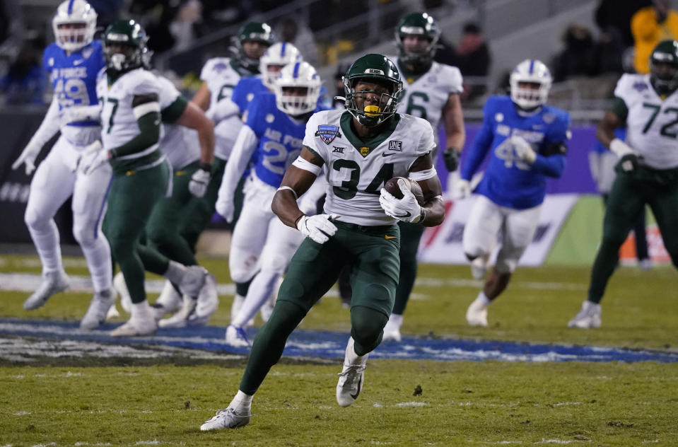 Baylor wide receiver Josh Cameron (34) runs after catching a pass against Air Force during the first half of the Armed Forces Bowl NCAA college football game in Fort Worth, Texas, Thursday, Dec. 22, 2022. (AP Photo/LM Otero)