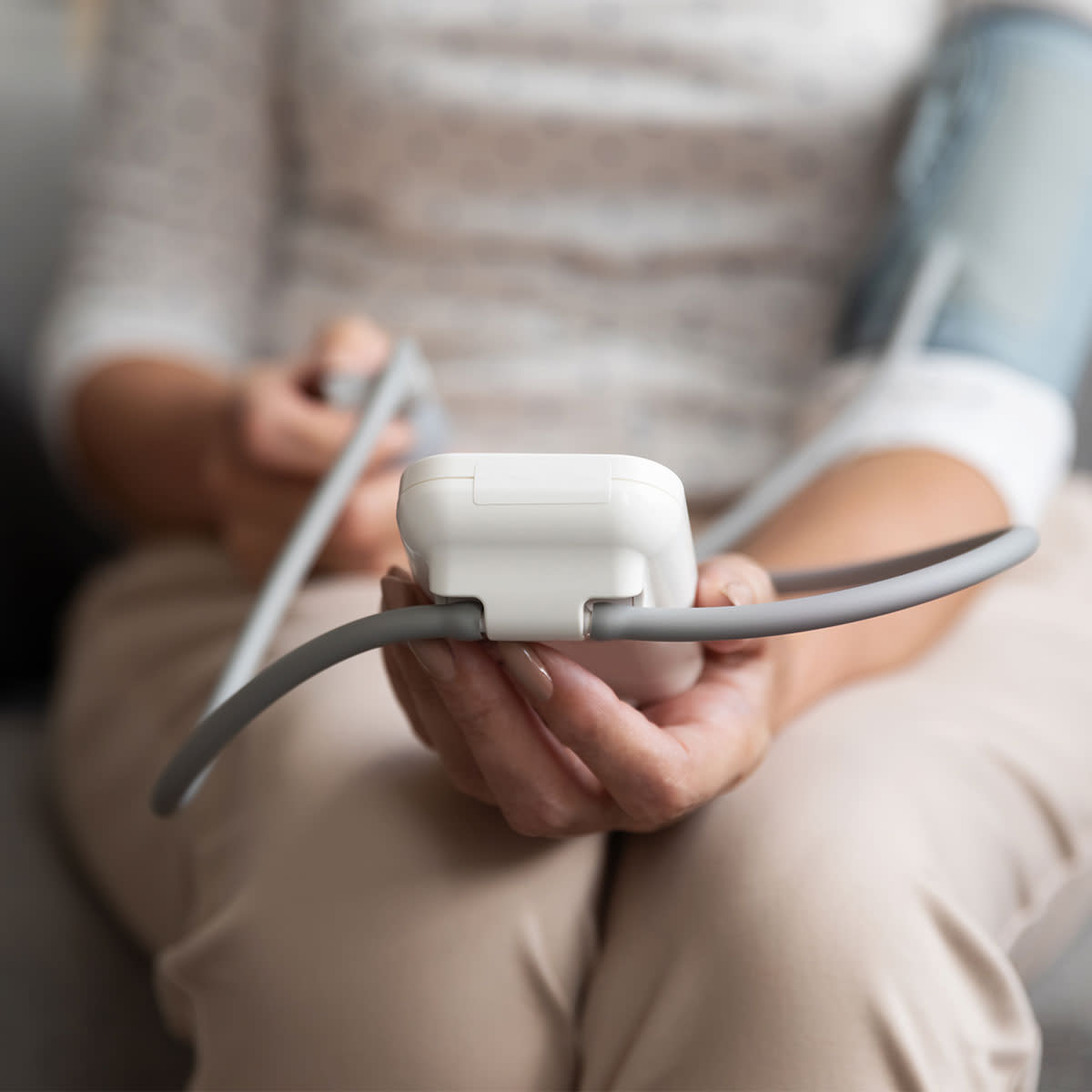 woman checking blood pressure at home