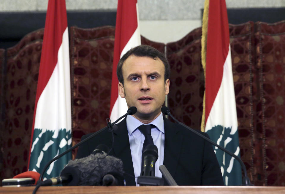 FILE - In this Tuesday, Jan. 24, 2017 file photo, French presidential candidate and former French Economy Minister Emmanuel Macron speaks during a press conference at the Government House, in downtown Beirut, Lebanon. French President Emmanuel Macron is traveling to Lebanon on Thursday Aug. 6, 2020, to offer support for the country after the massive, deadly explosion in Beirut. Lebanon is a former French protectorate and the countries retain close political and economic ties. (AP Photo/Bilal Hussein, File)