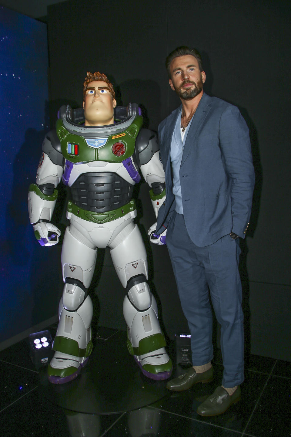 Chris Evans poses with the character Buzz Lightyear for photographers upon arrival for the premiere of the film 'Lightyear' in London, Monday, June 13, 2022. (Photo by Joel C Ryan/Invision/AP)