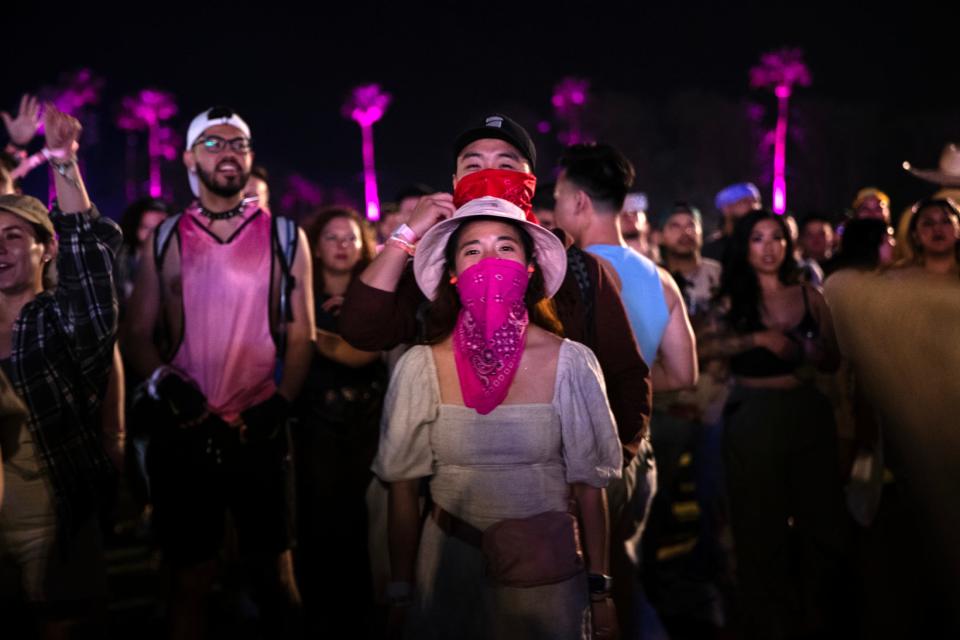 BLACKPINK fans watch their headlining show on the Coachella Stage during the Coachella Valley Music and Arts Festival in Indio, Calif., on Saturday, April 15, 2023. 