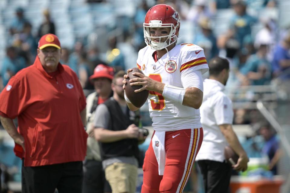 Chiefs coach Andy Reid watches quarterback Blaine Gabbert (9) warms up before a game against the Jaguars.
