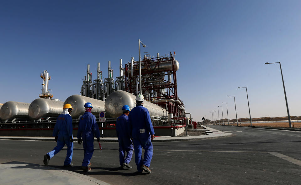 Workers walk inside the Shams 1, Concentrated Solar power (CSP) plant. (MARWAN NAAMANI/AFP/Getty Images)