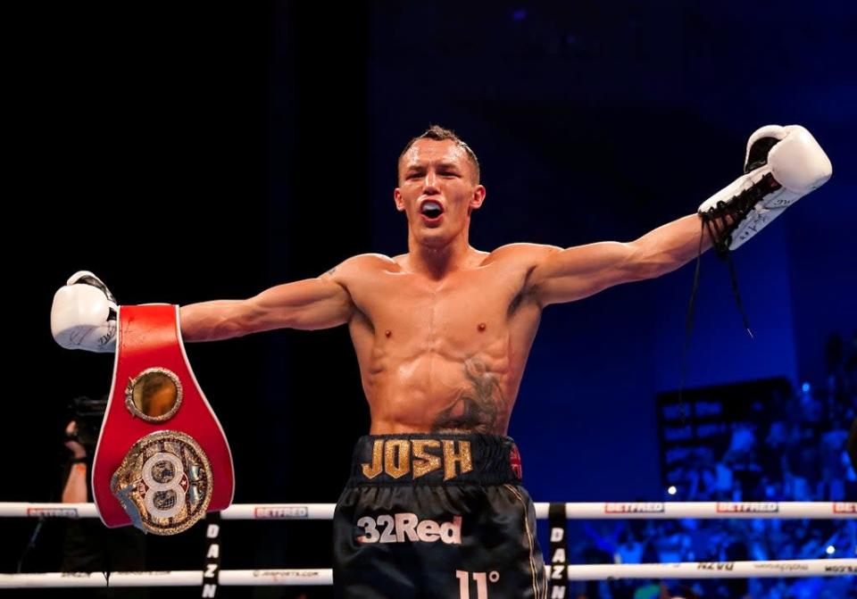 Josh Warrington celebrates after regaining the IBF featherweight to become a two-time world champion (Martin Rickett/PA) (PA Wire)