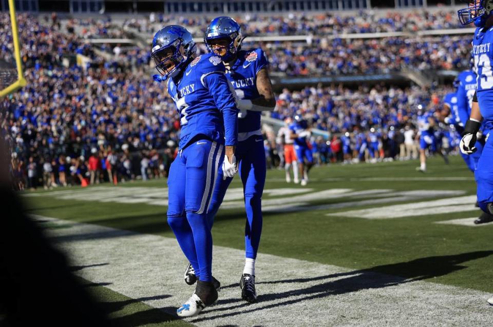 Kentucky wide receiver Barion Brown (7) celebrates his first quarter touchdown with wide receiver Dane Key (6) against Clemson in the TaxSlayer Gator Bowl. Brown scored one touchdown rushing, one receiving and one on a kickoff return but lost a fumble that led to the Tigers taking a late lead.