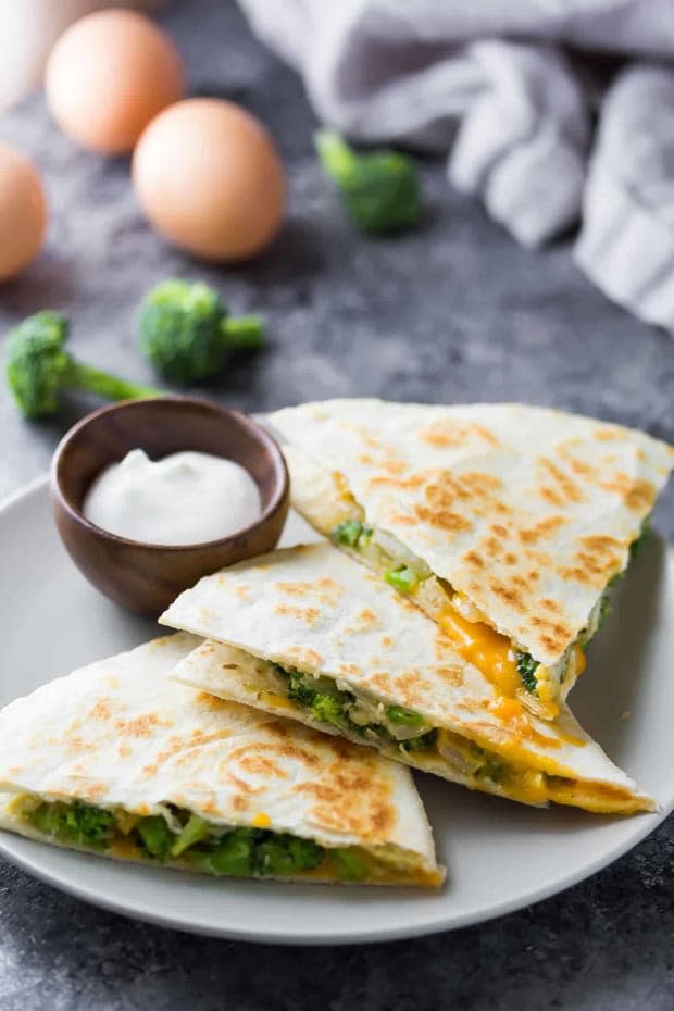 <p>Broccoli cheddar breakfast quesadillas are a great alternative to breakfast burritos…crispy, cheesy and sneakily full of vegetables. Stock up the freezer for easy breakfasts.</p><p><strong>Get the recipe: <a href="https://sweetpeasandsaffron.com/broccoli-cheddar-breakfast-quesadillas/" rel="nofollow noopener" target="_blank" data-ylk="slk:Broccoli and Cheddar Breakfast Quesadillas;elm:context_link;itc:0;sec:content-canvas" class="link "><em>Broccoli and Cheddar Breakfast Quesadillas</em></a></strong></p><p>Sweet Peas and Saffron</p>