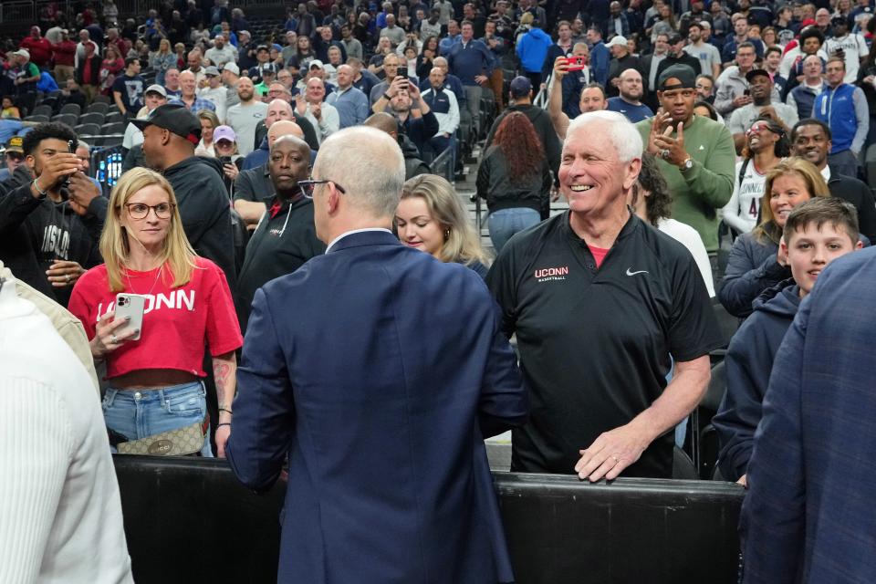 Mar 23, 2023; Las Vegas, NV, USA; UConn Huskies head coach Dan Hurley (center) with his father Bob Hurley (right) after their win against the Arkansas Razorbacks at T-Mobile Arena. Mandatory Credit: Joe Camporeale-USA TODAY Sports